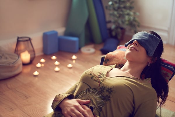 Attractive mixed race woman doing restorative yoga