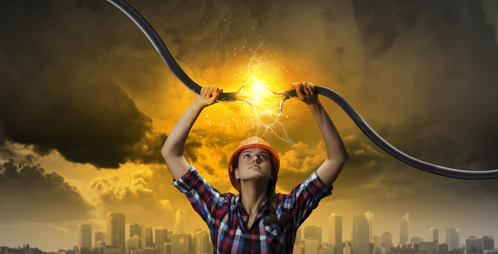 Image of woman holding electricity cable above head